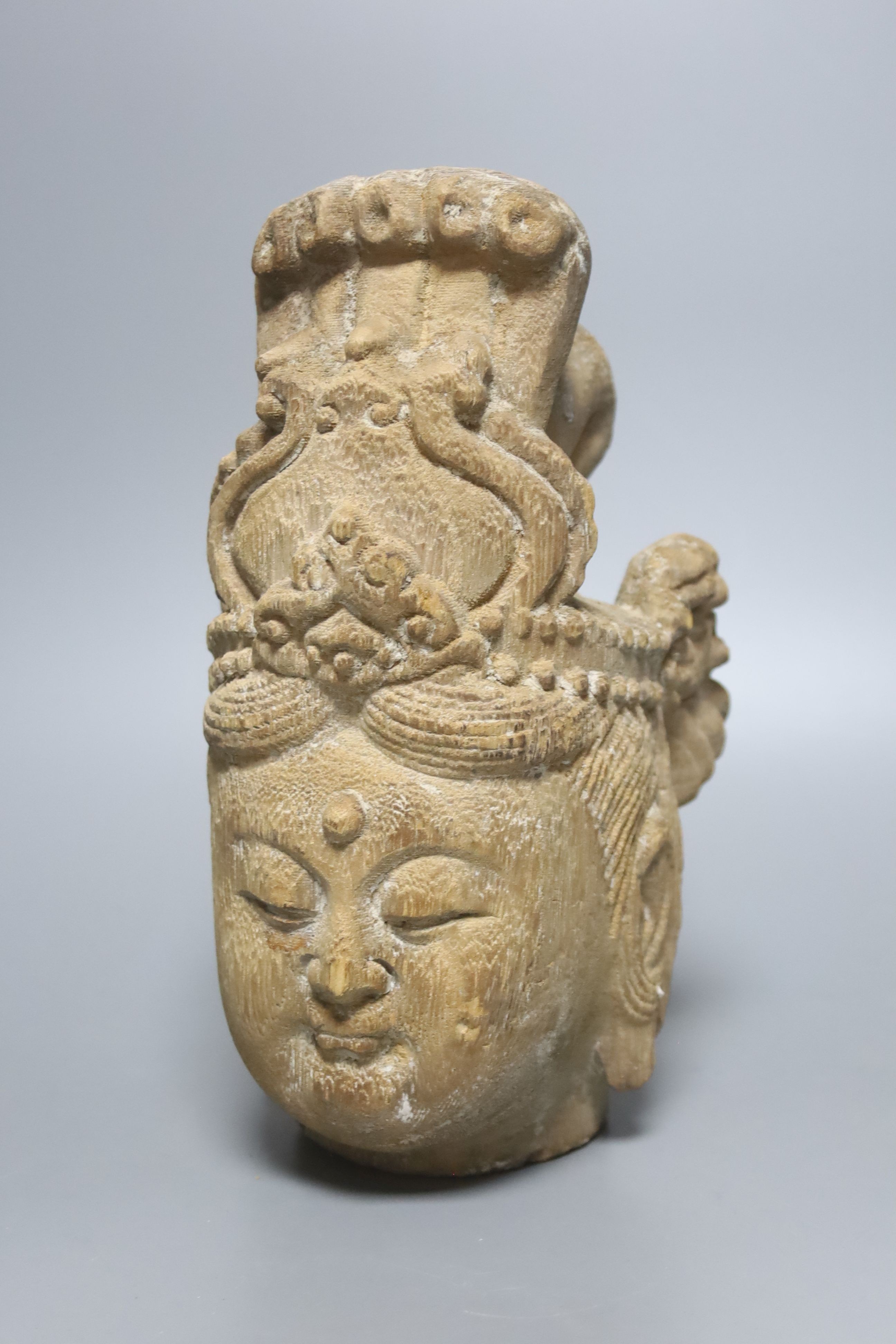 A Chinese carved wood head of Guanyin 24cm